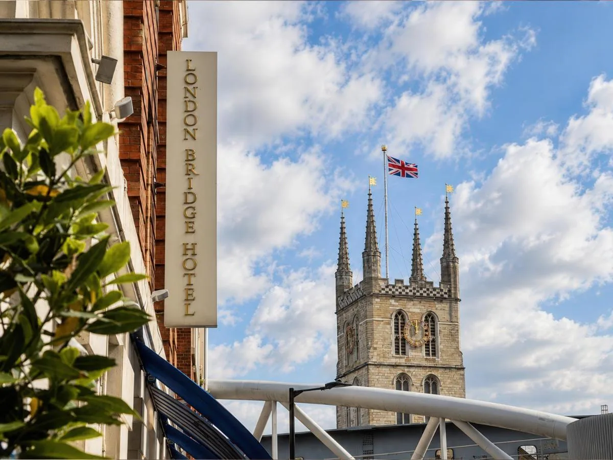 Tower and flag above London Bridge Hotel in Southwark, London